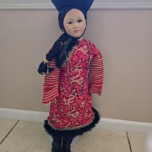 Ceramic Doll with Red and Black Traditional Attire